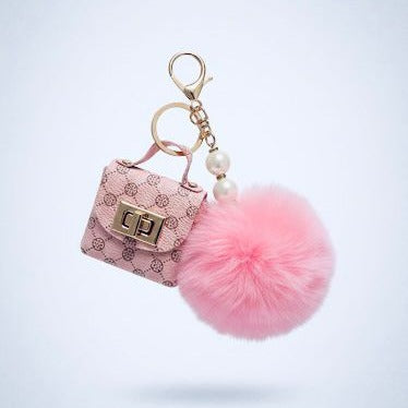 Pompon-Taschenanhänger – flauschig mit Mini-Tasche