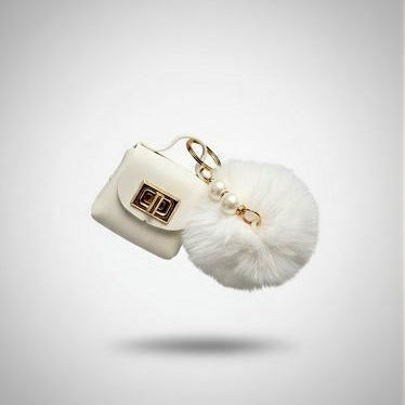 Pompon-Taschenanhänger – flauschig mit Mini-Tasche